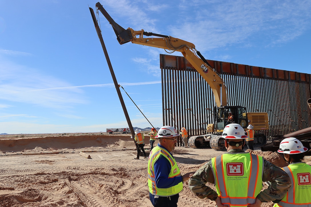 U.S. Army Corps of Engineers South Pacific Border Task Force install border barrier panels at the BMGR-1 project site near Yuma, Arizona, Nov. 17. USACE is replacing permanent border barriers along the southern border of the U.S. at the direction of the U.S. Army by the Secretary of War, in response to the presidential national emergency declaration dated Jan. 20, 2025, authorizing the use of Section 2803 of Title 10, U.S. Code.