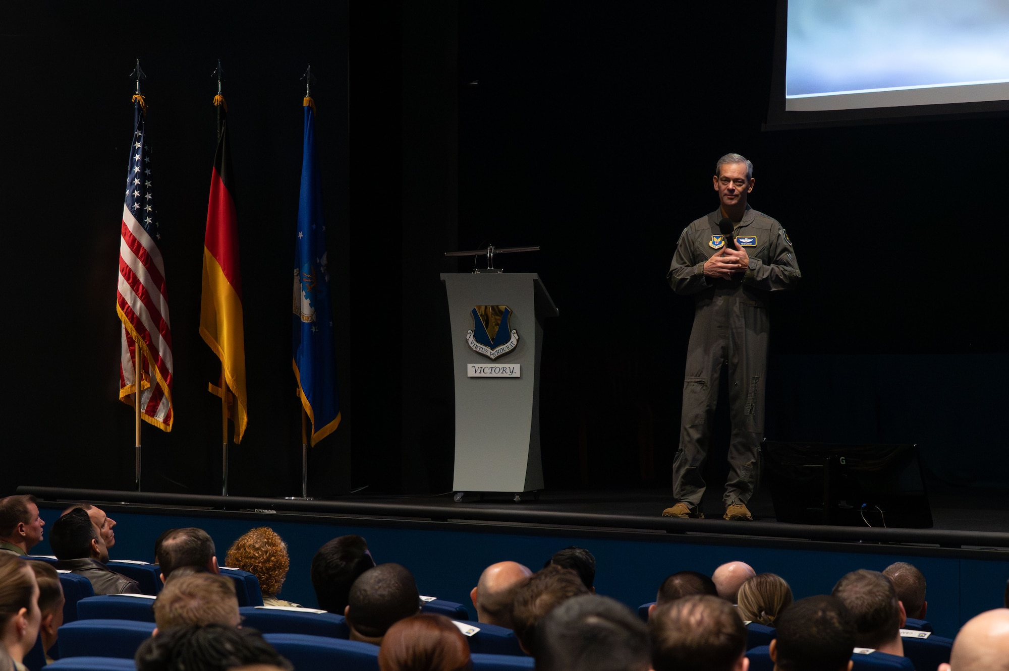 U.S. Air Force Chief of Staff Gen. Ken Wilsbach gives remarks on stage during a visit at Ramstein Air Base, Germany, Dec. 23, 2025. This visit offered Airmen across Team Ramstein a first look at the new leadership team and their priorities. (U.S. Air Force photo by Airman 1st Class Rebecca Harima)
