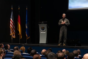 U.S. Air Force Chief of Staff Gen. Ken Wilsbach gives remarks on stage during a visit at Ramstein Air Base, Germany, Dec. 23, 2025. This visit offered Airmen across Team Ramstein a first look at the new leadership team and their priorities. (U.S. Air Force photo by Airman 1st Class Rebecca Harima)