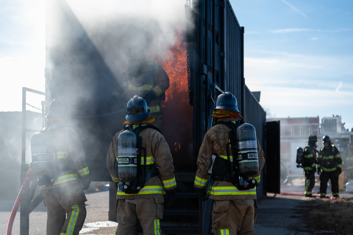 firefighters participate in live fire training