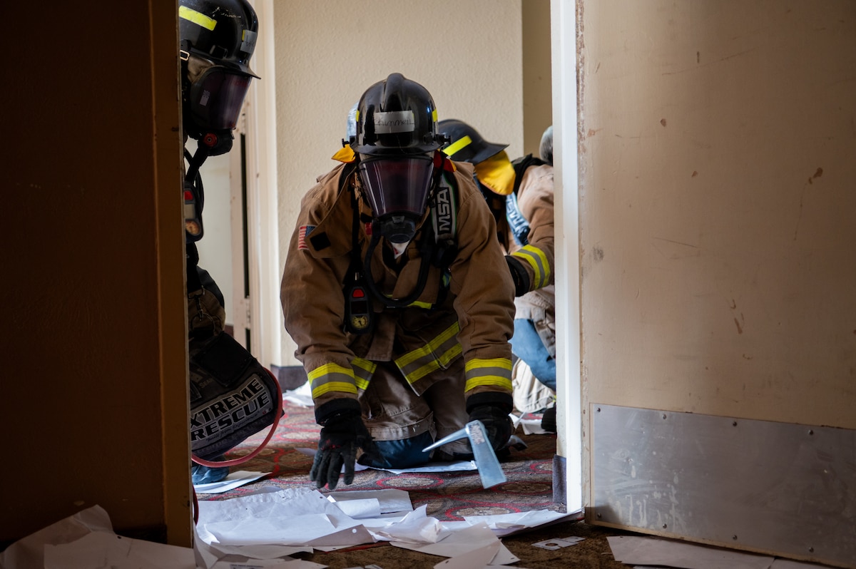firefighter crawls during training