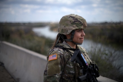 A U.S. Soldier with the Texas Army National Guard looks across the Rio Grande River near Roma, Texas, while taking part in border operations with the Texas Tactical Border Force, Feb. 5, 2025.