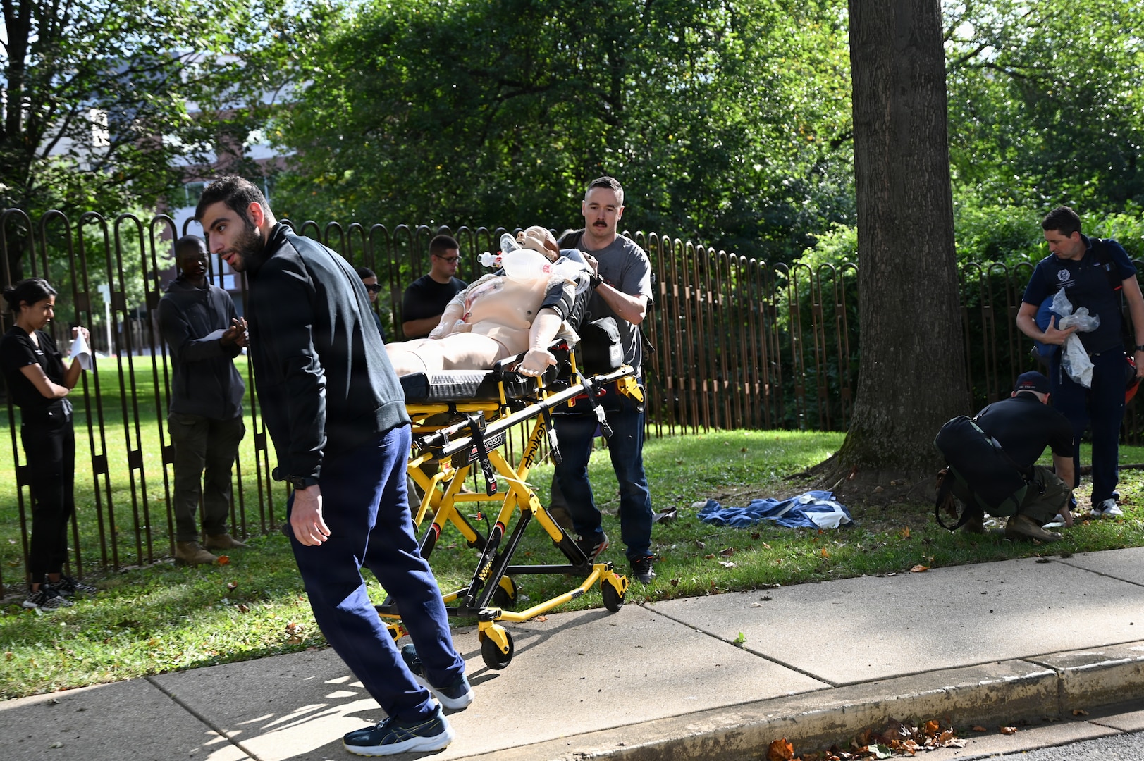 Members of the D.C. National Guard's 33rd Weapons of Mass Destruction Civil Support Team (WMD-CST) join MedStar Health SiTEL clinicians, physicians, and medical students for an advanced emergency simulation in Northwest Washington, D.C., Aug. 28, 2025. The joint exercise tested rapid medical response in contaminated and high-risk environments, strengthening interagency readiness and ensuring both partners are better prepared to protect the community.