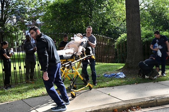Members of the D.C. National Guard's 33rd Weapons of Mass Destruction Civil Support Team (WMD-CST) join MedStar Health SiTEL clinicians, physicians, and medical students for an advanced emergency simulation in Northwest Washington, D.C., Aug. 28, 2025. The joint exercise tested rapid medical response in contaminated and high-risk environments, strengthening interagency readiness and ensuring both partners are better prepared to protect the community.