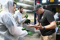 Members of the D.C. National Guard's 33rd Weapons of Mass Destruction Civil Support Team (WMD-CST) join MedStar Health SiTEL clinicians, physicians, and medical students for an advanced emergency simulation in Northwest Washington, D.C., Aug. 28, 2025. The joint exercise tested rapid medical response in contaminated and high-risk environments, strengthening interagency readiness and ensuring both partners are better prepared to protect the community.