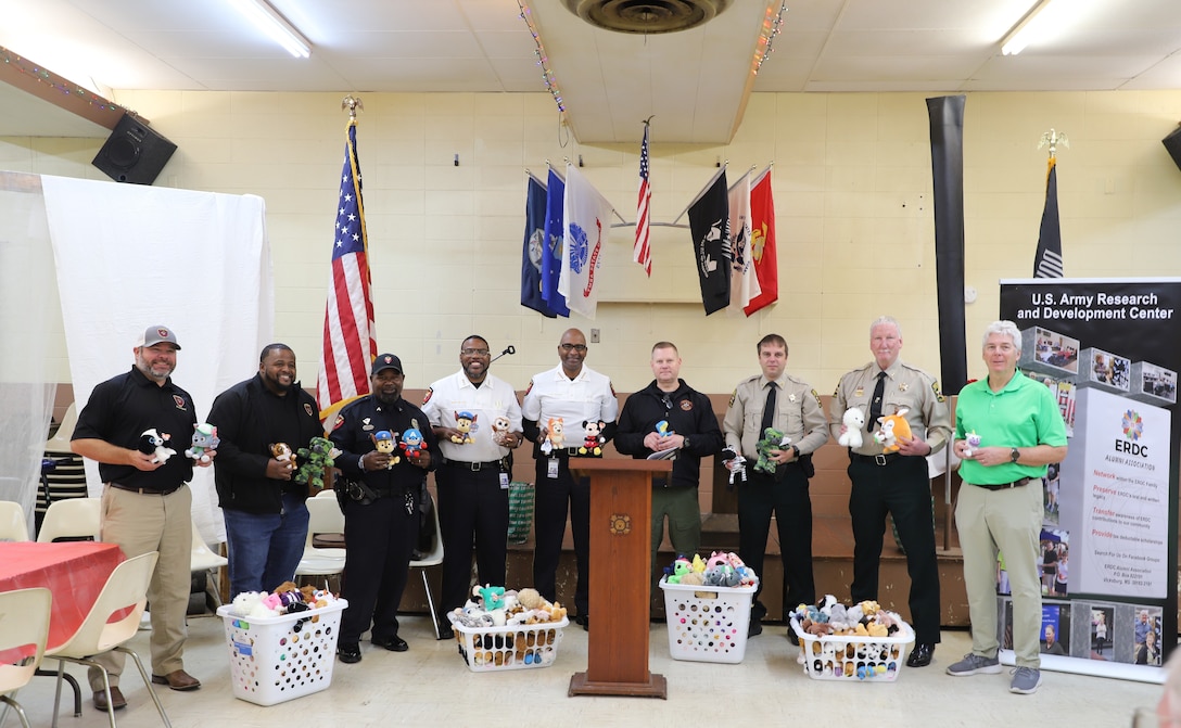Vicksburg’s fire, law enforcement and emergency management officials showed their appreciation to the ERDC Alumni Association for their donations. Pictured (left to right) are Vicksburg Fire Depart Chief Trey Martin and Associate Chief Courtney Reed;  Vicksburg Police Department Officer Michael Battle, Deputy Chief Tommy Curtis and Chief Larry Burns; Warren County Emergency Management Director John Elfer; Warren County Sheriff’s Department Chief Deputy Bobby Stewart; and ERDC Alumni Association member Ernie Smith.