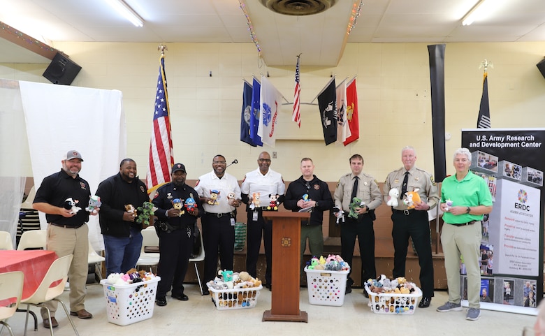 Vicksburg’s fire, law enforcement and emergency management officials showed their appreciation to the ERDC Alumni Association for their donations. Pictured (left to right) are Vicksburg Fire Depart Chief Trey Martin and Associate Chief Courtney Reed;  Vicksburg Police Department Officer Michael Battle, Deputy Chief Tommy Curtis and Chief Larry Burns; Warren County Emergency Management Director John Elfer; Warren County Sheriff’s Department Chief Deputy Bobby Stewart; and ERDC Alumni Association member Ernie Smith.