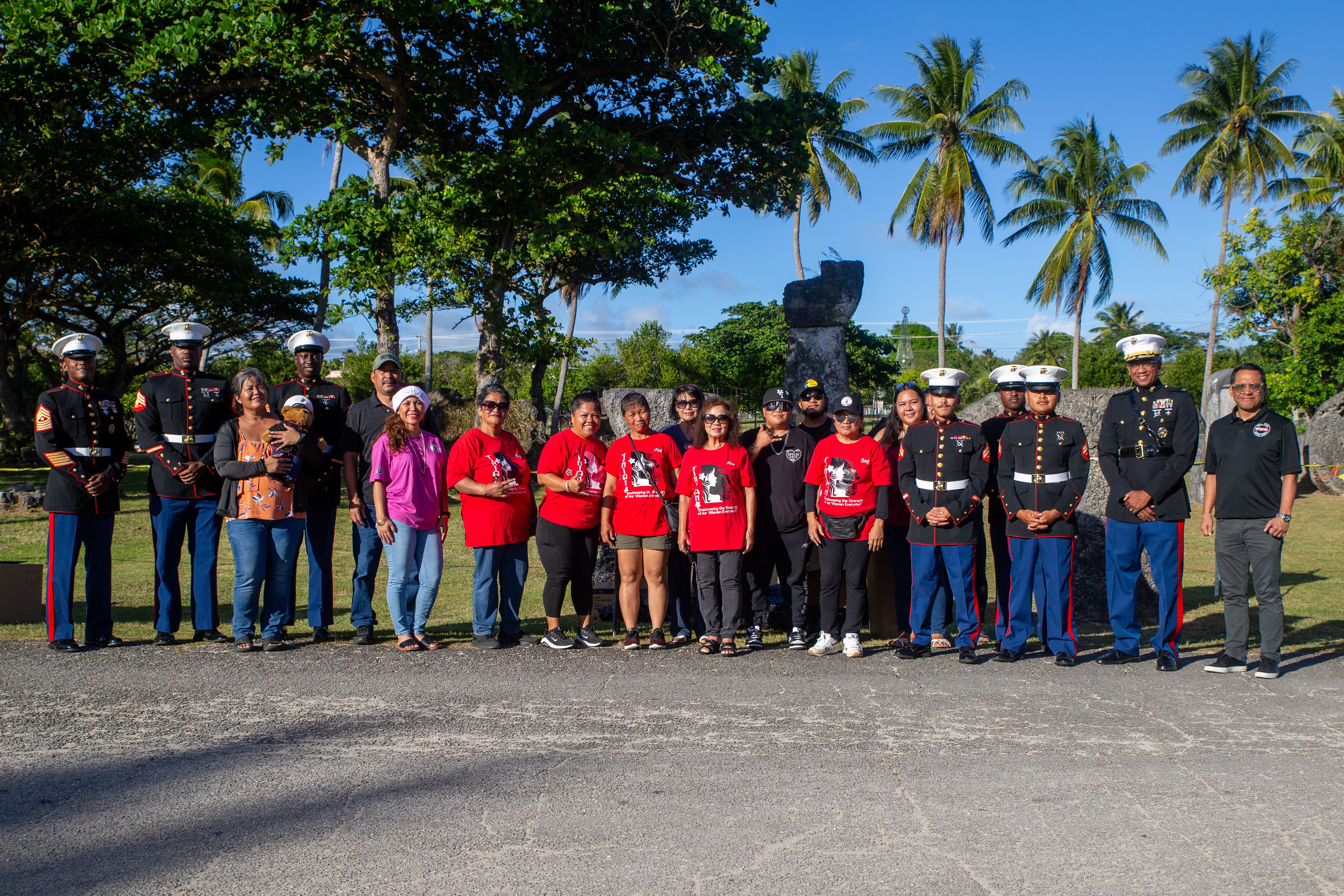 U.S. Marines with Marine Corps Base Camp Blaz, and volunteers with Tinian International Women's Alliance, pose for a photo during the distribution of toys for the Toys for Tots Campaign, San Jose, Tinian, Dec. 18, 2025. This year marks the 78th year of the national Marine Corps Toys for Tots Campaign and the 9th year in the Commonwealth of the Northern Mariana Islands. The mission of the Toys for Tots Program is to collect new, unwrapped toys and distribute those toys to children at Christmas. (U.S. Marine Corps photo by Lance Cpl. Afton Smiley)