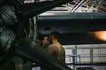U.S. Master Sgt. Dan Doyle and Tech Sgt. Alex Morin, propulsion technicians with the 103d Maintenance Group, complete engine maintenance on a C-130 Hercules in the hangar in East Granby, Conn., on Oct. 3, 2025. Flying Yankee maintainers took on additional workloads over the last year to ensure the fleet received 3.5 engine modifications in time for a summer deployment. Photo by Captain Jen Kaprielian.