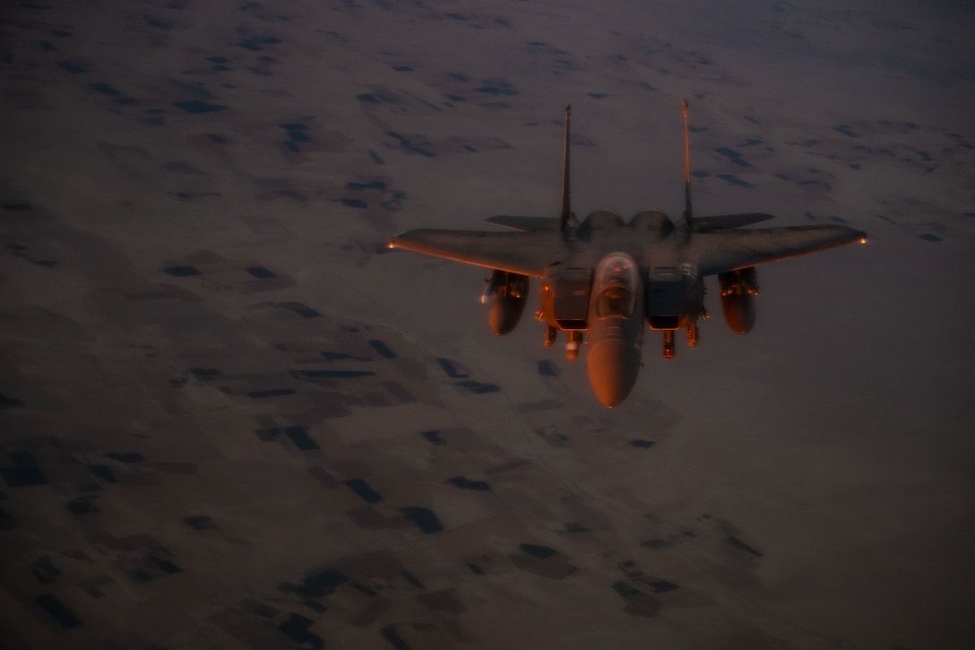 A U.S. Air Force F-15E Strike Eagle aircraft assigned to the 391st Expeditionary Fighter Squadron backs out after refueling over the U.S. Central Command area of responsibility, Oct. 29, 2025. Aerial refueling allows aircraft to extend their combat range and loiter time, allowing them to remain airborne for longer periods and remain effective throughout the CENTCOM AOR. (U.S. Air Force photo by Tech. Sgt. Nicholas Monteleone)