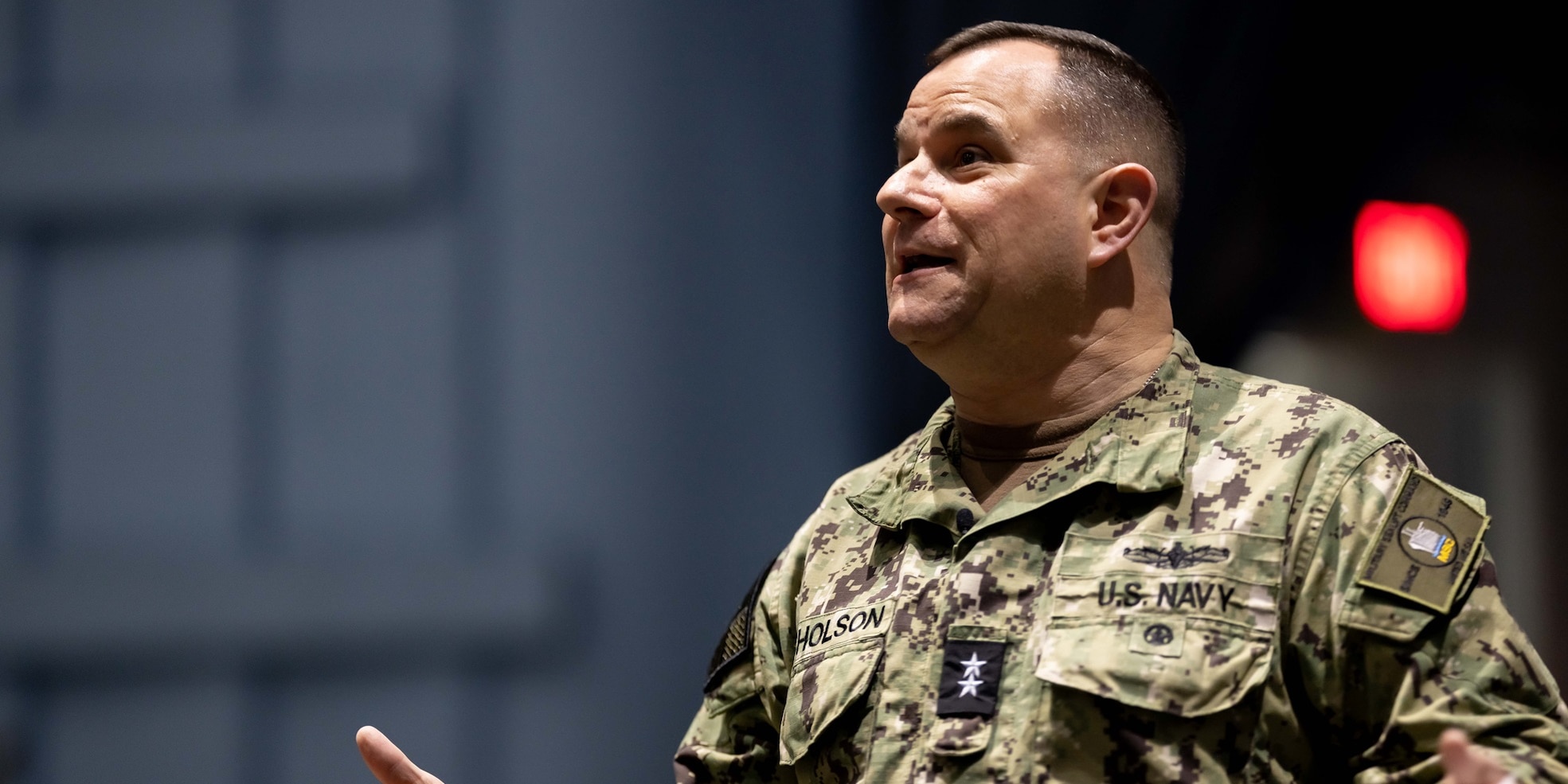 Rear Adm. Benjamin R. Nicholson, Commander, Military Sealift Command (MSC), delivers remarks during an all-hands call at Naval Station Norfolk, Dec. 18, 2025. MSC directs and supports operations for approximately 140 civilian-crewed ships that replenish U.S. Navy ships at sea, conduct specialized missions, preposition combat cargo at sea around the world, perform a variety of support services, and move military equipment and supplies to deployed U.S. forces.