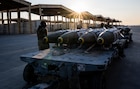 U.S. CENTRAL COMMAND AREA OF RESPONSIBILITY (Dec. 18, 2025) U.S. Airmen prepare to load GBU-31 munition systems onto F-15E Strike Eagles at a base in the U.S. Central Command area of responsibility, Dec. 18, 2025. (U.S. Air Force Photo)