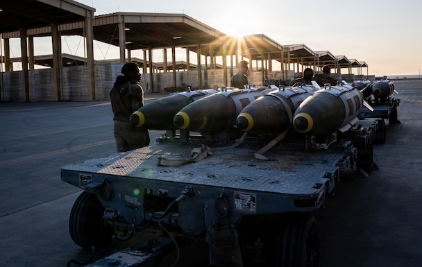 U.S. CENTRAL COMMAND AREA OF RESPONSIBILITY (Dec. 18, 2025) U.S. Airmen prepare to load GBU-31 munition systems onto F-15E Strike Eagles at a base in the U.S. Central Command area of responsibility, Dec. 18, 2025. (U.S. Air Force Photo)