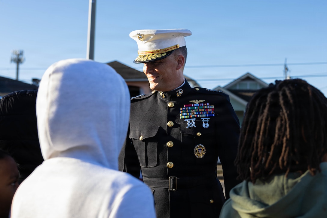 U.S. Marine Corps Lt. Gen. Leonard F. Anderson IV, commander of Marine Forces Reserve and Marine Forces South, speaks to a group of children waiting in line to attend a Toys for Tots event at the Zulu Social Aid and Pleasure Club in New Orleans, Dec. 20, 2025. The Zulu Social Aid and Pleasure Club, New Orleans’ largest predominantly African American Carnival organization, hosted a Toys for Tots event open to the local community of New Orleans, where attendees received gifts provided by the Marine Corps and fellow members of the community. (U.S. Marine Corps photo by Lance Cpl. Claire Cheney)