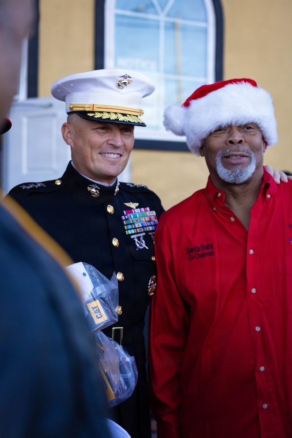 U.S. Marine Corps Lt. Gen. Leonard F. Anderson IV, commander of Marine Forces Reserve and Marine Forces South, poses for a picture with Nicholas Spears, the chairman of the Zulu Social Aid and Pleasure Club, during a Toys for Tots event at the Zulu Social Aid and Pleasure Club in New Orleans, Dec. 20, 2025. The Zulu Social Aid and Pleasure Club, New Orleans’ largest predominantly African American Carnival organization, hosted a Toys for Tots event open to the local community of New Orleans, where attendees received gifts provided by the Marine Corps and fellow members of the community. (U.S. Marine Corps photo by Lance Cpl. Claire Cheney)