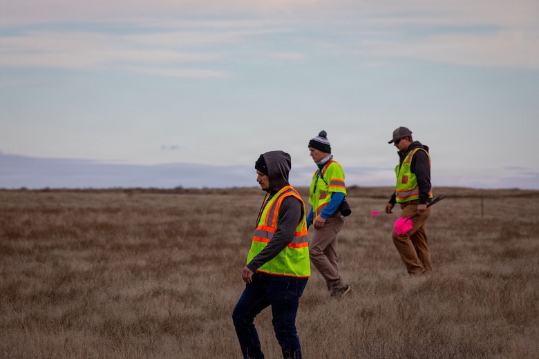 (left to right) Mitchel Bieber, Rogan Maxwell & Evan Parsons, Military Munitions Response Program staff, conduct fieldwork at the former Umatilla Chemical Depot in Hermiston, Oregon, Nov. 18, 2025. The team conducted visual inspections of the buffer area while looking for signs of munitions. The area must pass inspection and be declared safe before it can be handed over to the Oregon National Guard’s Rees Training Center for use as training grounds. (U.S. Army photo by Makenzie Leonard)