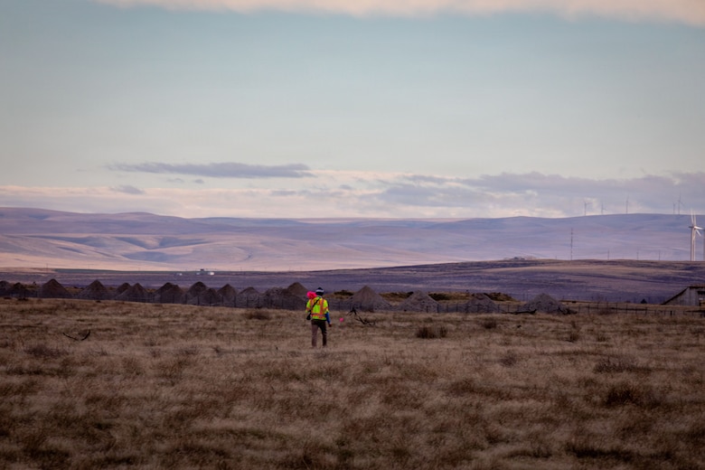Military Munitions Response Program field assistant Rogan Maxwell conducts fieldwork at the former Umatilla Chemical Depot in Hermiston, Oregon, Nov. 18, 2025. The team conducted visual inspections of the buffer area while looking for signs of munitions. The area must pass inspection and be declared safe before it can be handed over to the Oregon National Guard’s Rees Training Center for use as training grounds. (U.S. Army photo by Makenzie Leonard)