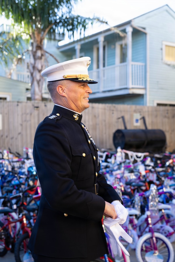 U.S. Marine Corps Lt. Gen. Leonard F. Anderson IV, commander of Marine Forces Reserve and Marine Forces South, looks over toys provided by the Zulu Social Aid and Pleasure Club during a Toys for Tots event at the Zulu Social Aid and Pleasure Club in New Orleans, Dec. 20, 2025. The Zulu Social Aid and Pleasure Club, New Orleans’ largest predominantly African American Carnival organization, hosted a Toys for Tots event open to the local community of New Orleans, where attendees received gifts provided by the Marine Corps and fellow members of the community. (U.S. Marine Corps photo by Lance Cpl. Claire Cheney)