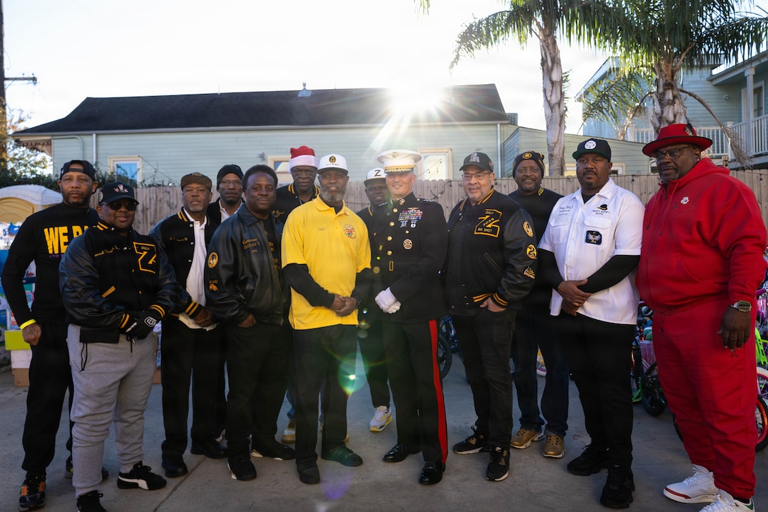 U.S. Marine Corps Lt. Gen. Leonard F. Anderson IV, commander of Marine Forces Reserve and Marine Forces South, poses for a photo with members of the Zulu Social Aid and Pleasure Club during a Toys for Tots event at the Zulu Social Aid and Pleasure Club in New Orleans, Dec. 20, 2025. The Zulu Social Aid and Pleasure Club, New Orleans’ largest predominantly African American Carnival organization, hosted a Toys for Tots event open to the local community of New Orleans, where attendees received gifts provided by the Marine Corps and fellow members of the community. (U.S. Marine Corps photo by Lance Cpl. Claire Cheney)