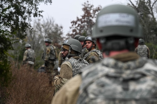 Airmen conduct a patrol during a training exercise.