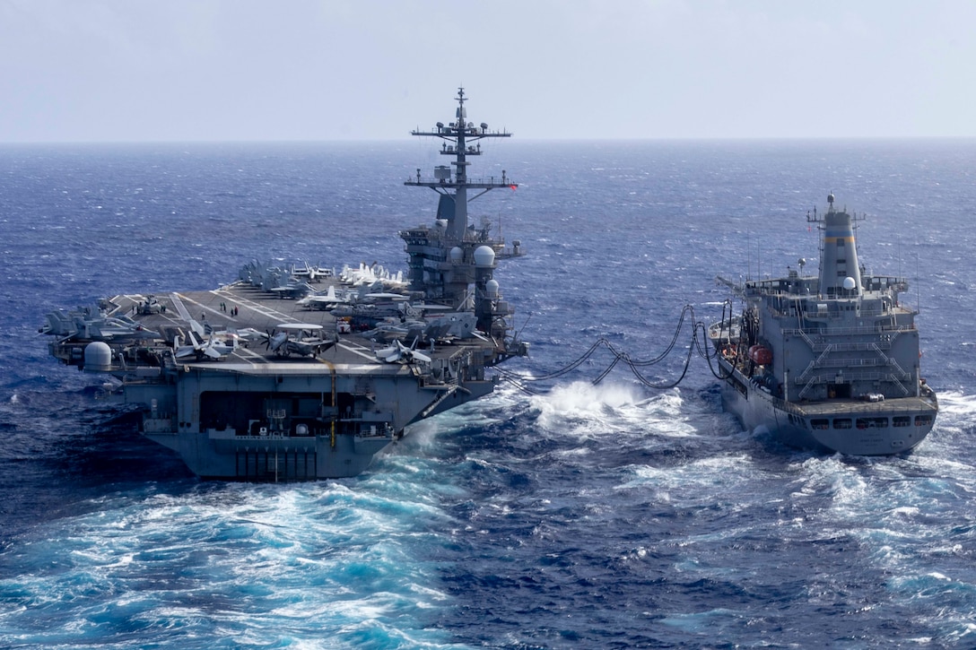 USS Abraham Lincoln conducts fueling-at-sea with USNS Henry J