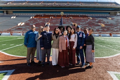 U.S. Space Force 2nd Lt. Kimo Martinez, Air Force ROTC Detachment 825, poses with his family and friends for a group photo after his winter commissioning ceremony at Darrell K Royal–Texas Memorial Stadium in Austin, Texas, Dec. 21, 2025.