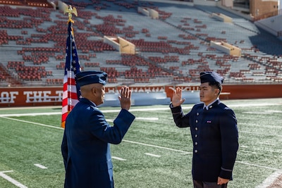 Cadet Kimo Martinez, Air Force ROTC Detachment 825, affirms the oath of office during his commissioning ceremony at Darrell K. Royal–Texas Memorial Stadium in Austin, Texas, Dec. 21, 2025.