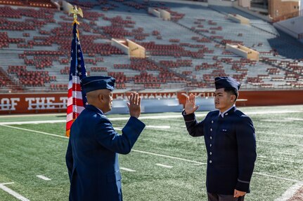 Cadet Kimo Martinez, Air Force ROTC Detachment 825, affirms the oath of office during his commissioning ceremony at Darrell K. Royal–Texas Memorial Stadium in Austin, Texas, Dec. 21, 2025.