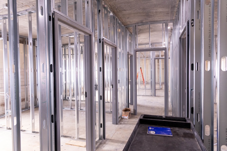 A room under construction with silver framing.