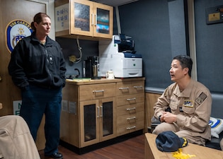 251208-N-IX644-1002 (Dec. 8, 2025) MAYPORT, Fla. U.S. Navy Capt. Alden Chiu, right, Force Surgeon, Naval Surface Force Atlantic, speaks with Cmdr. Meagan Makarenko, executive officer, USS Carney (DDG 64), during the pilot of the Joint Operational Medicine Information System (JOMIS) Operational Medicine Care Delivery Platform (OpMed CDP), in Mayport, Dec. 8. For 250 years, Navy Medicine — represented by more than 44,000 highly-trained military and civilian healthcare professionals — has delivered quality healthcare and enduring expeditionary medical support to the warfighter on, below, and above the sea, and ashore. (U.S. Navy photo by Mass Communication Specialist 2nd Class Sasha Ambrose)