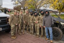 U.S. Air Force Chief Master Sgt. Andrew McKendree, Command Chief Master Sgt. of the 16th Air Force, poses for a group photo with members of the 9th Security Forces Squadron (SFS) on Beale Air Force Base, California, Dec. 17, 2025.