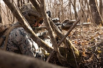 A U.S. Marine with 1st Battalion, 6th Marines, forward deployed with 4th Marine Regiment, 3rd Marine Division as part of the Unit Deployment Program, sets up security during a casualty evacuation drill during Fuji Viper 26.2 at the Combined Arms Training Center, Camp Fuji, Japan, Dec. 12, 2025.