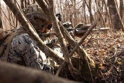 JAPAN (Dec. 12, 2025) — A U.S. Marine with 1st Battalion, 6th Marines, forward deployed with 4th Marine Regiment, 3rd Marine Division as part of the Unit Deployment Program, sets up security during a casualty evacuation drill during Fuji Viper 26.2...