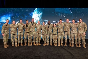 Photos of SLD 30 teams on-stage at Space Force Association Spacepower Conference