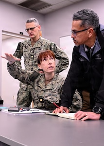 251209-N-IX644-1003 (Dec. 9, 2025) MAYPORT, Fla. U.S. Navy Lt. Cmdr. Erik Lawrence, left, U.S. Navy chief nursing informatics officer for Joint Operational Medicine Information System (JOMIS) assigned to U.S. Navy Bureau of Medicine and Surgery, Lt. Cmdr. Elise Brandon, assigned to Naval Medical Forces Atlantic, and Joe Espinosa from the JOMIS Program Office, discuss the data seeding process in the JOMIS Operational Medicine Care Delivery Platform (OpMed CDP), during a pilot onboard USS Carney (DDG 64) in Mayport, Dec. 9. For 250 years, Navy Medicine — represented by more than 44,000 highly-trained military and civilian healthcare professionals — has delivered quality healthcare and enduring expeditionary medical support to the warfighter on, below, and above the sea, and ashore. (U.S. Navy photo by Mass Communication Specialist 2nd Class Sasha Ambrose)