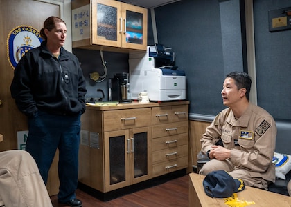 251208-N-IX644-1002 (Dec. 8, 2025) MAYPORT, Fla. U.S. Navy Capt. Alden Chiu, right, Force Surgeon, Naval Surface Force Atlantic, speaks with Cmdr. Meagan Makarenko, executive officer, USS Carney (DDG 64), during the pilot of the Joint Operational Medicine Information System (JOMIS) Operational Medicine Care Delivery Platform (OpMed CDP), in Mayport, Dec. 8. For 250 years, Navy Medicine — represented by more than 44,000 highly-trained military and civilian healthcare professionals — has delivered quality healthcare and enduring expeditionary medical support to the warfighter on, below, and above the sea, and ashore. (U.S. Navy photo by Mass Communication Specialist 2nd Class Sasha Ambrose)