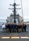 251208-N-IX644-1001 (Dec. 8, 2025) MAYPORT, Fla. U.S. Navy Sailors assigned to the USS Carney (DDG 64) and various Navy Medicine commands, alongside civilian and contractor partners, pose for a photo on the ship's flight deck during the pilot of the Joint Operational Medicine Information System (JOMIS) Operational Medicine Care Delivery Platform (OpMed CDP), a new modernized digital health record system, in Mayport, Fla., Dec. 8, 2025. For 250 years, Navy Medicine has delivered quality healthcare and enduring expeditionary medical support to the warfighter on, below, and above the sea, and ashore.  (U.S. Navy photo by Mass Communication Specialist 2nd Class Sasha Ambrose)