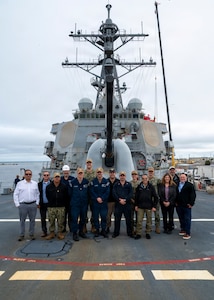 251208-N-IX644-1001 (Dec. 8, 2025) MAYPORT, Fla. U.S. Navy Sailors assigned to the USS Carney (DDG 64) and various Navy Medicine commands, alongside civilian and contractor partners, pose for a photo on the ship's flight deck during the pilot of the Joint Operational Medicine Information System (JOMIS) Operational Medicine Care Delivery Platform (OpMed CDP), a new modernized digital health record system, in Mayport, Fla., Dec. 8, 2025. For 250 years, Navy Medicine has delivered quality healthcare and enduring expeditionary medical support to the warfighter on, below, and above the sea, and ashore.  (U.S. Navy photo by Mass Communication Specialist 2nd Class Sasha Ambrose)
