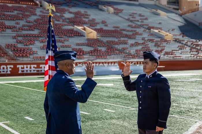 Cadet Kimo Martinez, Air Force ROTC Detachment 825, affirms the oath of office during his commissioning ceremony at Darrell K. Royal–Texas Memorial Stadium in Austin, Texas, Dec. 21, 2025.