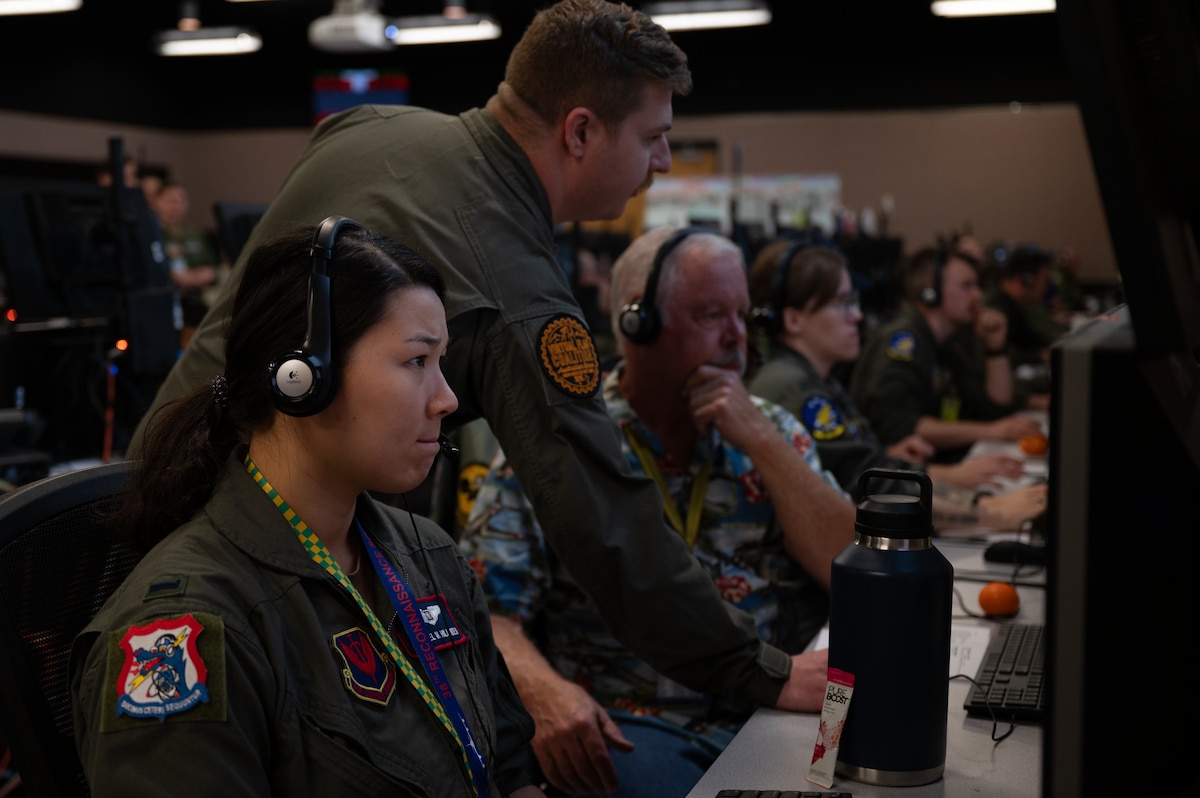 USAF Airmen work at computers