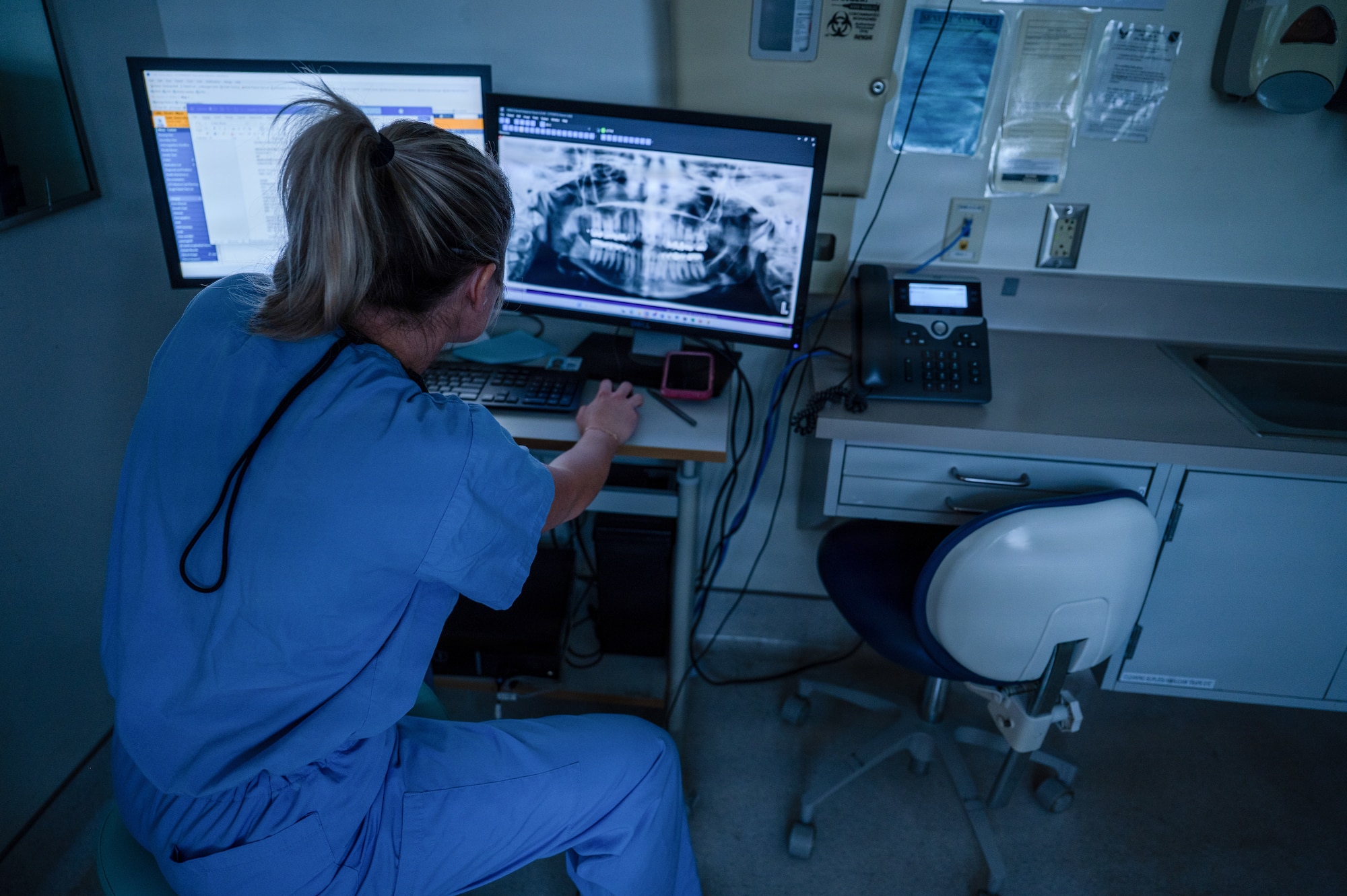 U.S. Air Force Capt. Taylor Smith, general dentist, Maxwell Medical Group, reviews a patient’s dental x-ray at Maxwell Air Force Base, Alabama, Oct. 9, 2025. Air Force members are required to have yearly dental checks to maintain their readiness to deploy. (U.S. Air Force photo by Senior Airman Evan Porter)