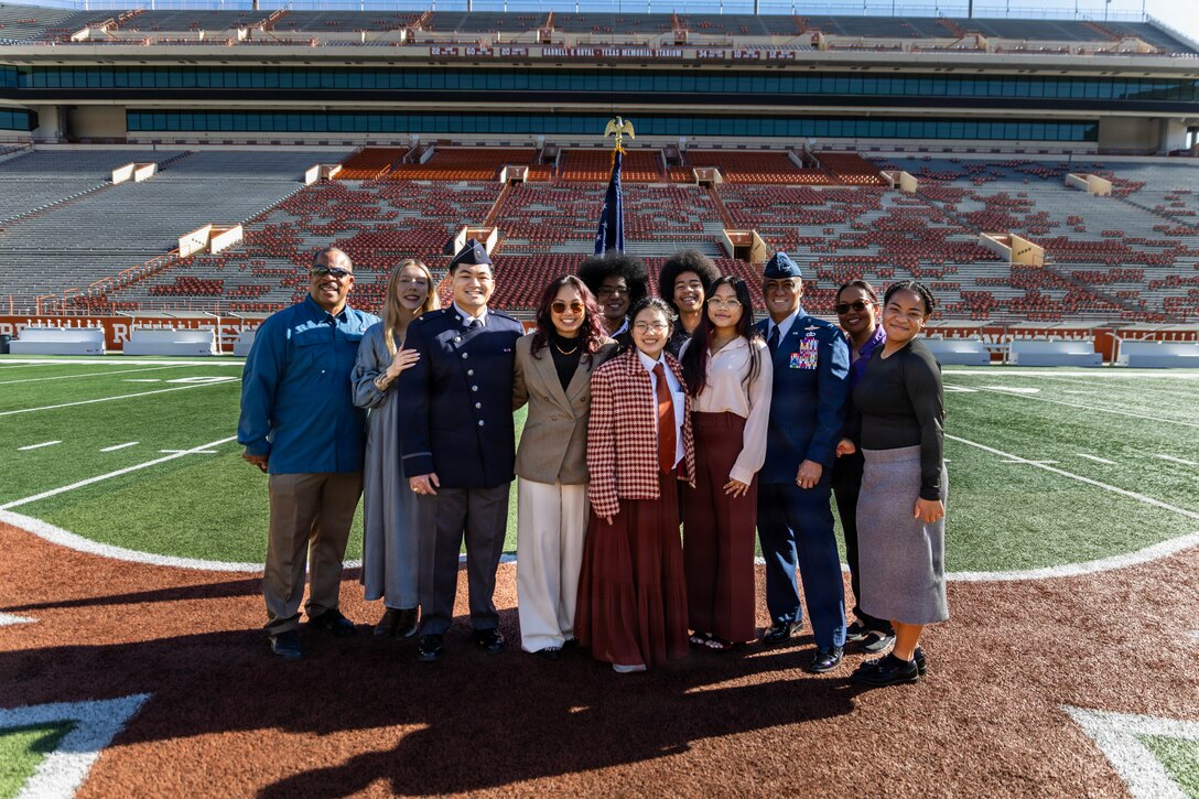 U.S. Space Force 2nd Lt. Kimo Martinez, Air Force ROTC Detachment 825, poses with his family and friends for a group photo after his winter commissioning ceremony at Darrell K Royal–Texas Memorial Stadium in Austin, Texas, Dec. 21, 2025.