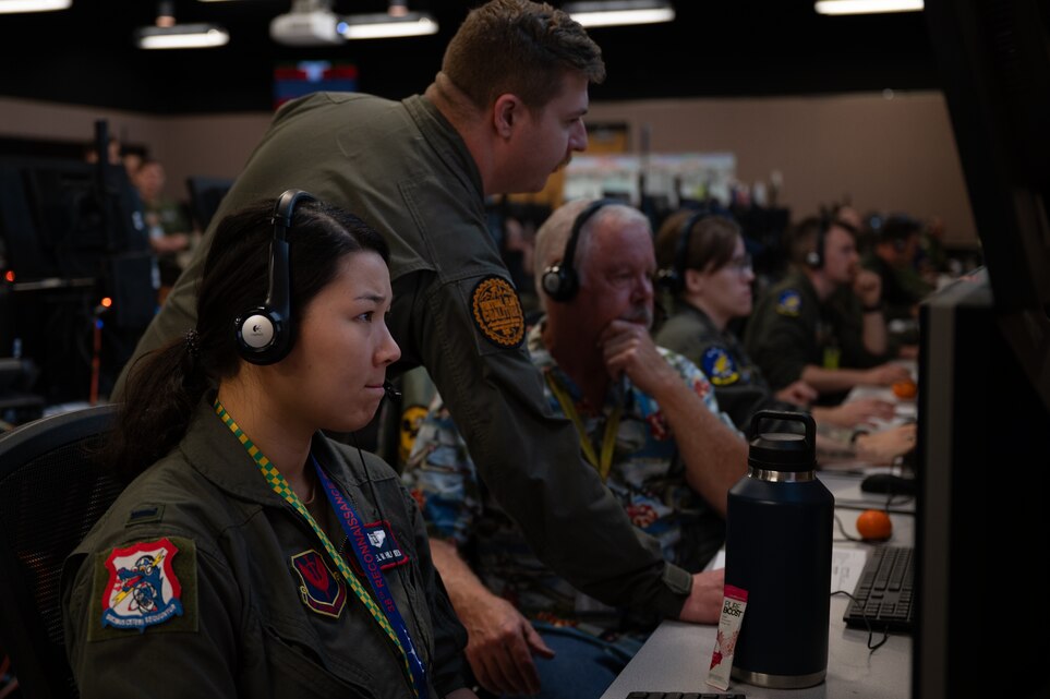 USAF Airmen work at computers