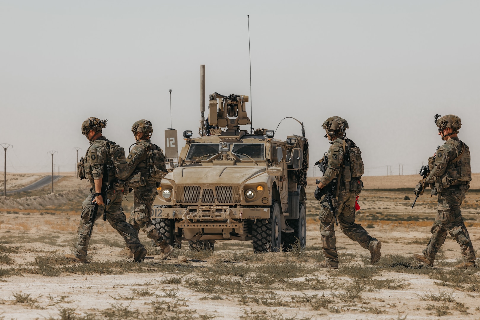 U.S. Soldiers assigned to Delta Company, 1st Battalion, 133rd Infantry Regiment, 2nd Brigade Combat Team, 34th Infantry Division, Iowa National Guard, provide security within the U.S. Central Command area of responsibility, Sept. 21, 2025. The unit, operating in support of Combined Joint Task Force – Operation Inherent Resolve, secured a landing zone to ensure the safe arrival of incoming personnel and visitors. (U.S. Army photo by Sgt. Zachary Ta)