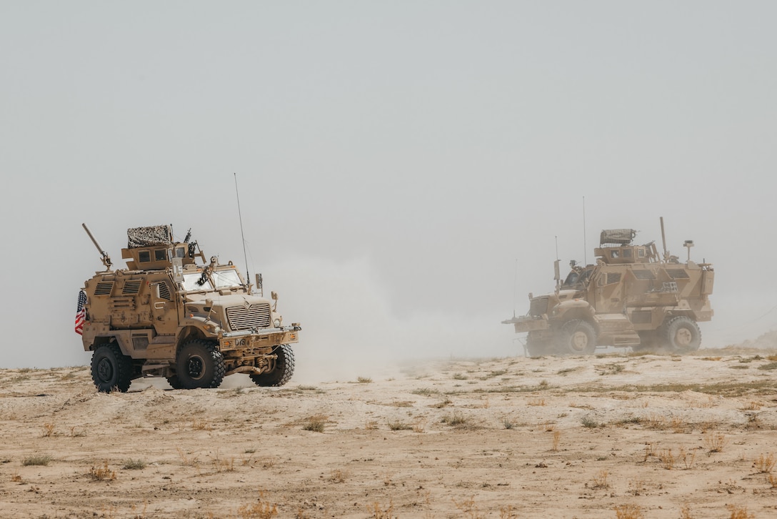 U.S. Soldiers assigned to Delta Company, 1st Battalion, 133rd Infantry Regiment, 2nd Brigade Combat Team, 34th Infantry Division, Iowa National Guard, operate Mine-Resistant Ambush Protected (MRAP) vehicles within the U.S. Central Command area of responsibility, Sept. 21, 2025. The unit, operating in support of Combined Joint Task Force – Operation Inherent Resolve, secured a landing zone to ensure the safe arrival of incoming personnel and visitors. (U.S. Army photo by Sgt. Zachary Ta)