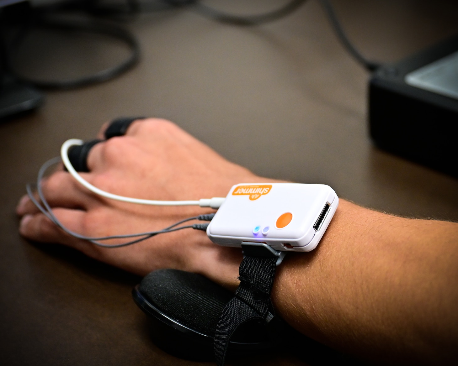 A bio metric transmitter used in a virtual reality (VR) testing station in the Naval Aerospace Medical Institute's (NAMI) behavioral research lab, Aug. 4. The device is used to measure pulse, reaction time, and stress levels as part of Assessing Spatial Abilities in Naval Aviation (ASANA). The data gathered is used in the updating and implementation of the Aviation Standardized Test Battery (ASTB). ASANA uses eye tracking, bio metric, reaction time, and behavioral monitoring to collect data in order to pair with a user's aptitude testing data to help determine their viability as an aviation officer candidate. With five detachments, 12 training centers, and facilities in over 60 locations across the United States, NMOTC provides high impact individual medical training for the Navy, other U.S. armed forces, and allied nations around the globe. (U.S. Navy photo by Mass Communication Specialist 1st Class Russell Lindsey SW/AW)