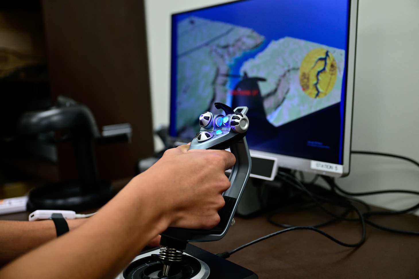 A naval aviation candidate uses a virtual reality (VR) testing station equipped with Assessing Spatial Abilities in Naval Aviation (ASANA) to gather data used in the updating and implementation of the Aviation Standardized Test Battery (ASTB) in the Naval Aerospace Medical Institute's (NAMI) behavioral research lab, Aug. 4. ASANA uses eye tracking, bio metric, reaction time, and behavioral monitoring to collect data in order to pair with a user's aptitude testing data to help determine their viability as an aviation officer candidate. With five detachments, 12 training centers, and facilities in over 60 locations across the United States, NMOTC provides high impact individual medical training for the Navy, other U.S. armed forces, and allied nations around the globe. (U.S. Navy photo by Mass Communication Specialist 1st Class Russell Lindsey SW/AW)