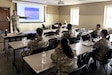 U.S. Army Sgt. 1st Class Brandon Nelson, left, a public affairs specialist with the 109th Mobile Public Affairs Detachment, instructs the unit on storytelling techniques at their mobilization station at Fort Hood, Texas, Dec. 21, 2025. The unit is preparing to deploy to Europe in support of U.S. Special Operations Command Europe. (U.S. Army National Guard photo by Maj. Travis Mueller)