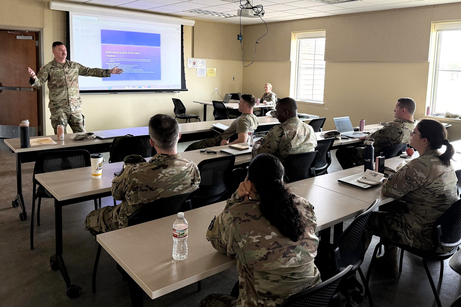 U.S. Army Sgt. 1st Class Brandon Nelson, left, a public affairs specialist with the 109th Mobile Public Affairs Detachment, instructs the unit on storytelling techniques at their mobilization station at Fort Hood, Texas, Dec. 21, 2025. The unit is preparing to deploy to Europe in support of U.S. Special Operations Command Europe. (U.S. Army National Guard photo by Maj. Travis Mueller)
