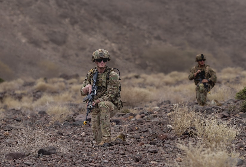 U.S. Soldiers assigned to Army Task Force Associator conduct security at a simulated crash site during exercise Bull Shark 25-2 at Arta Beach, Djibouti, May 6, 2025. Service members from Combined Joint Task Force - Horn of Africa and partner nations demonstrated agility and interoperability through joint maneuver, communication, and casualty evacuation drills. (U.S. Army photo by Staff Sgt. Ivan Mendez-Roman)
